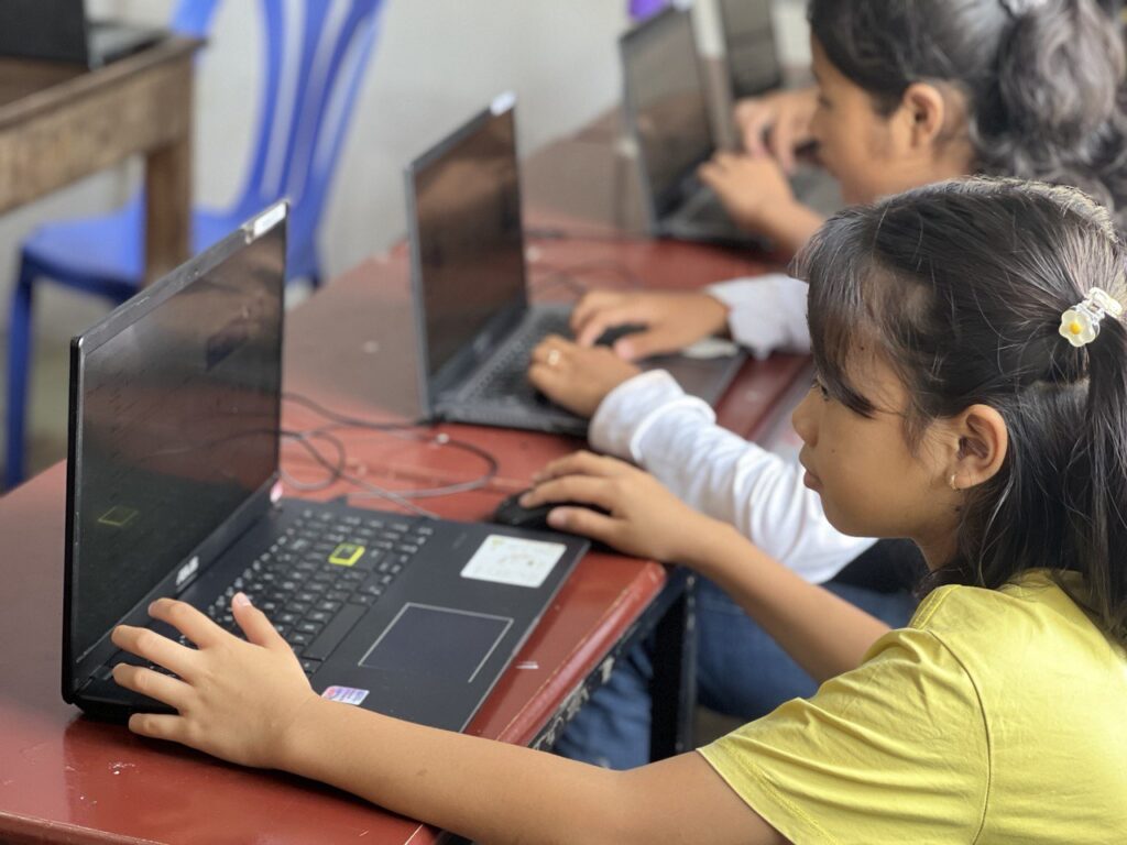 cambodian young girl on a computer
